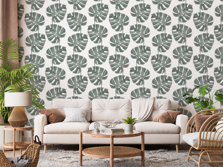 Doris – beige soffa med många gröna växter
